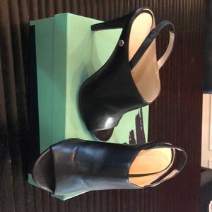 Black leather sling back mule